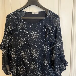 Navy & white top with 3/4 sleeves and ruffle detail from neck down the sleeves